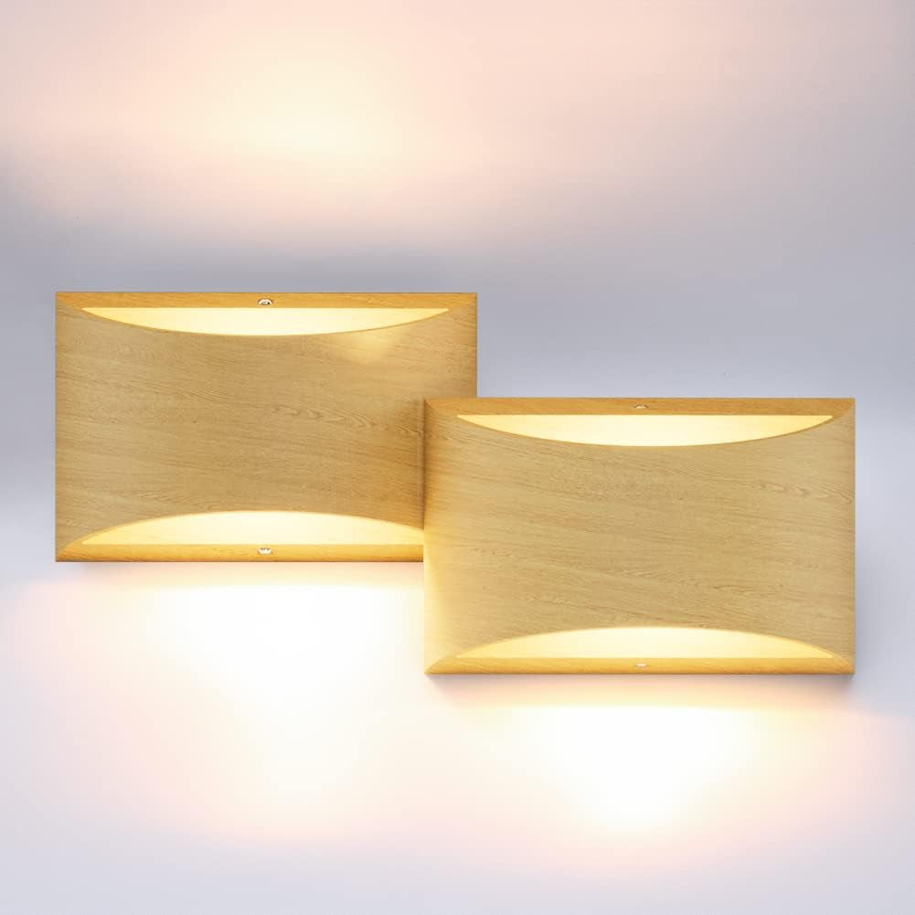 Two rectangular wall lights in a light wood finish mounted side-by-side, glowing warm light above and below.