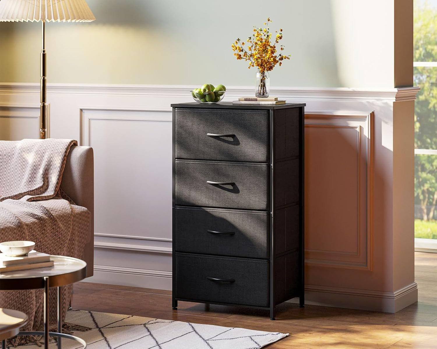 Black 4-drawer dresser staged in a living room showing full height and top styling