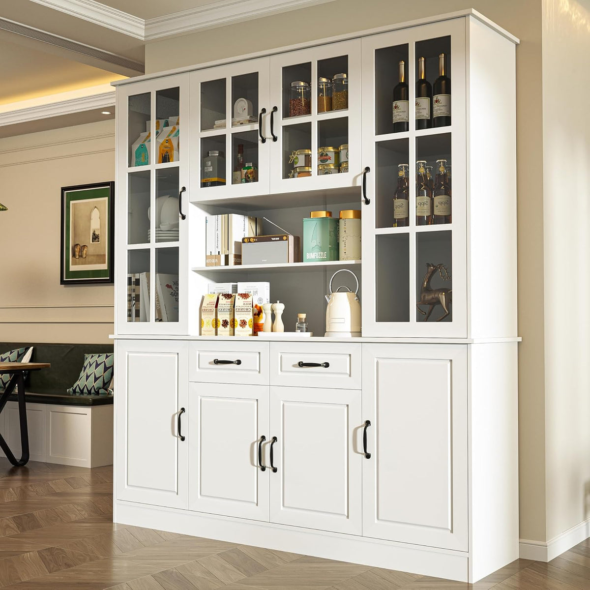 Angled front view of white china hutch showing glass upper doors and paneled lower cabinet doors