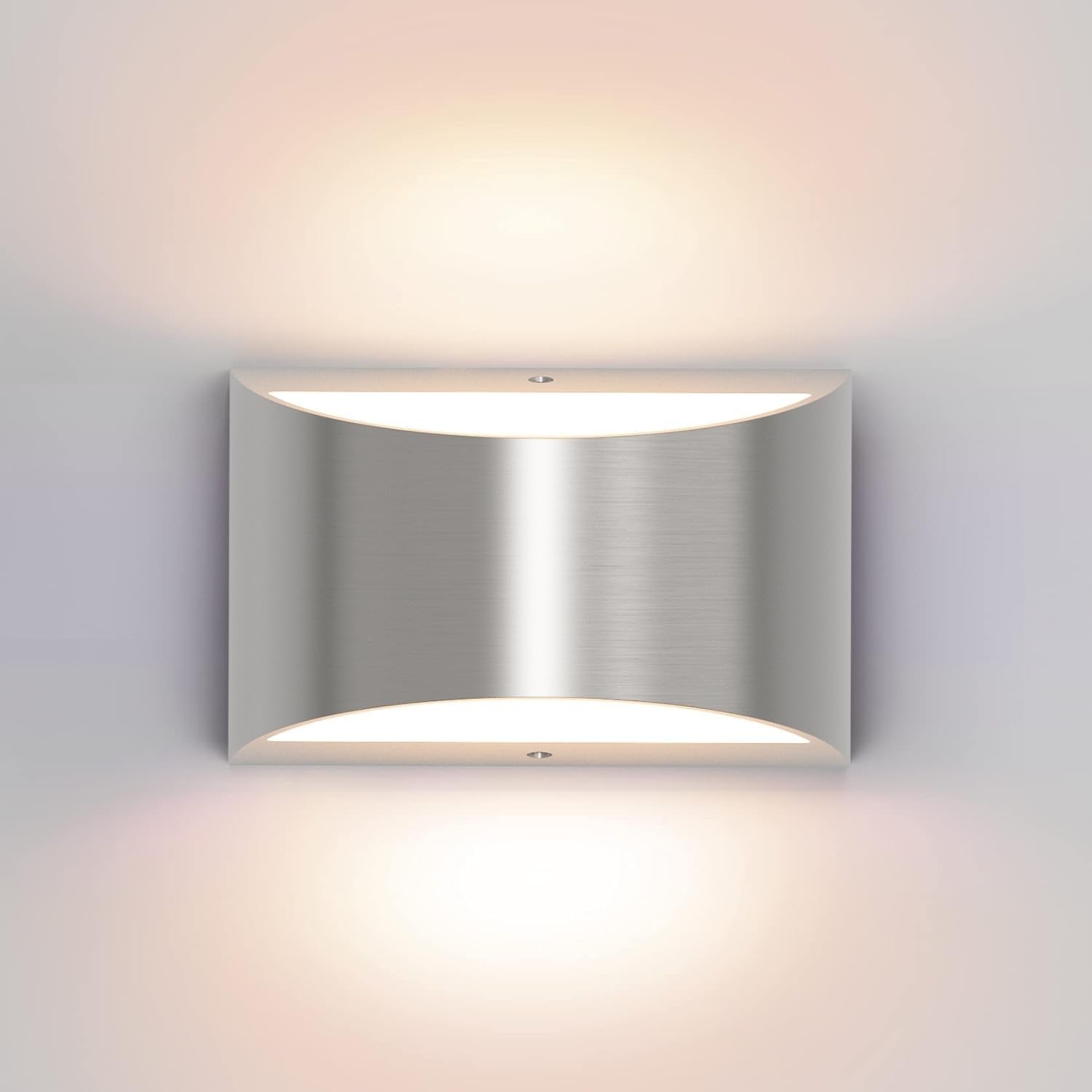 Single brushed metal wall sconce shown head-on with warm light glowing above and below.