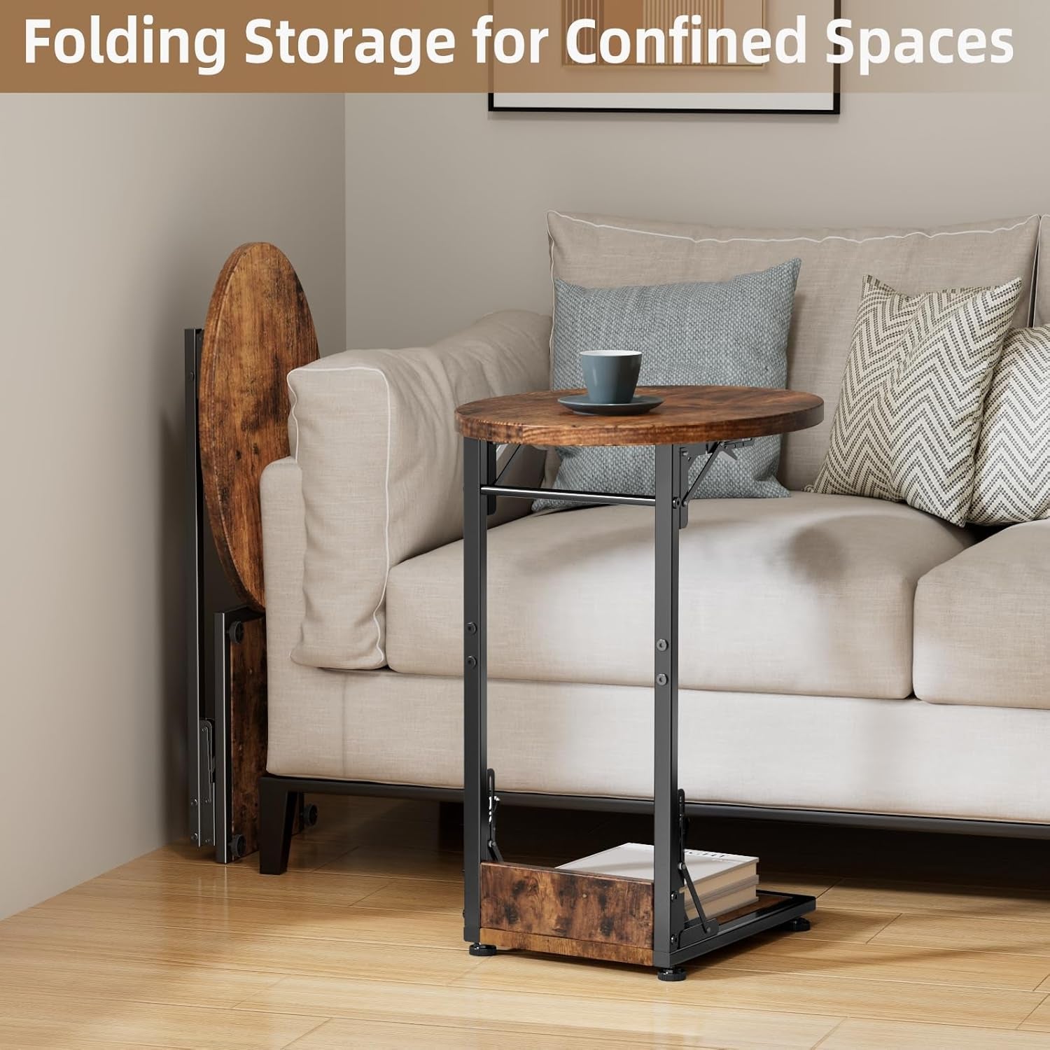 C-shaped two-tier side table next to a beige sofa, round wood top and metal frame, spare folded table leaned behind sofa.