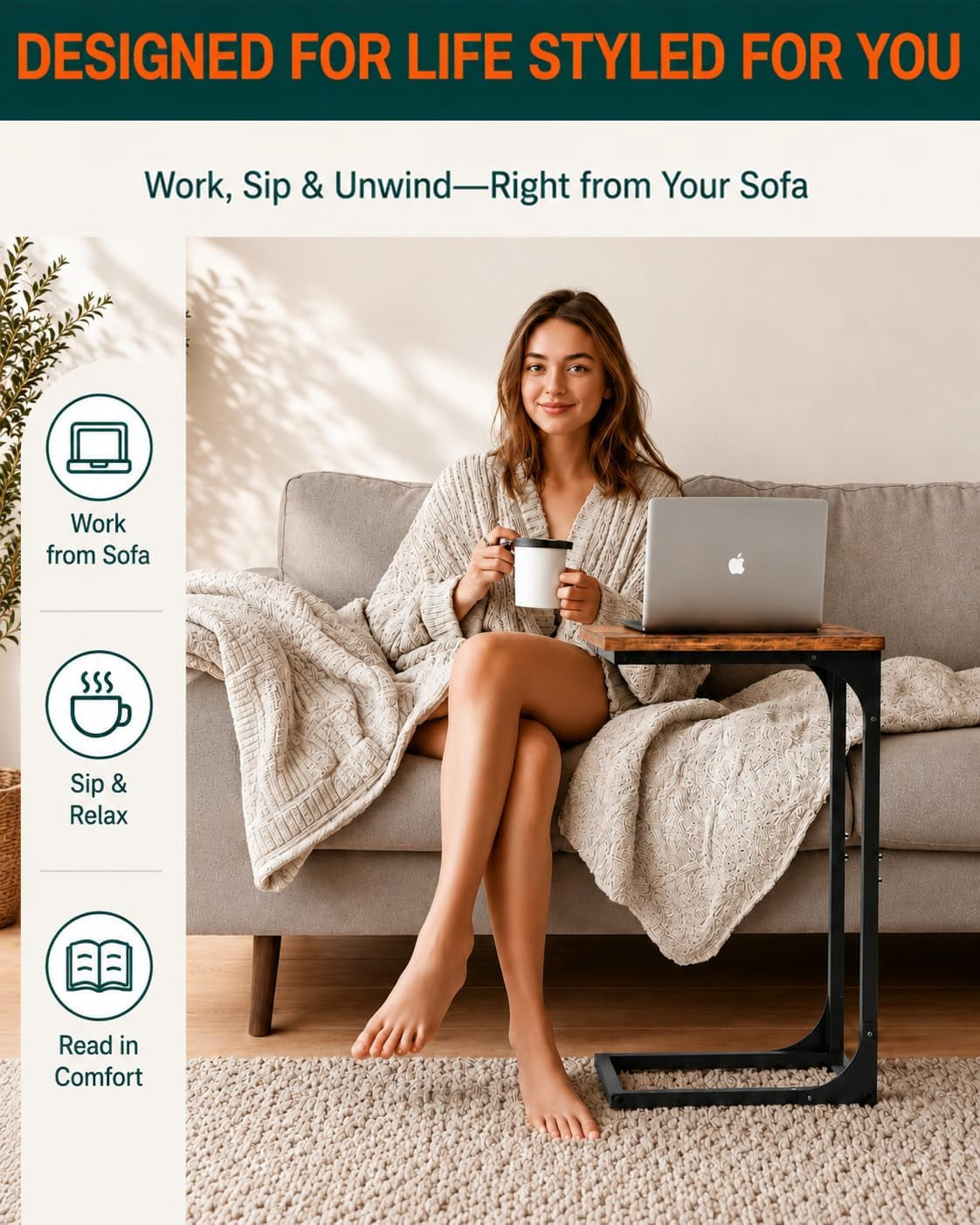 Woman seated on a sofa using the C-shaped end table with laptop and cup, lifestyle front view
