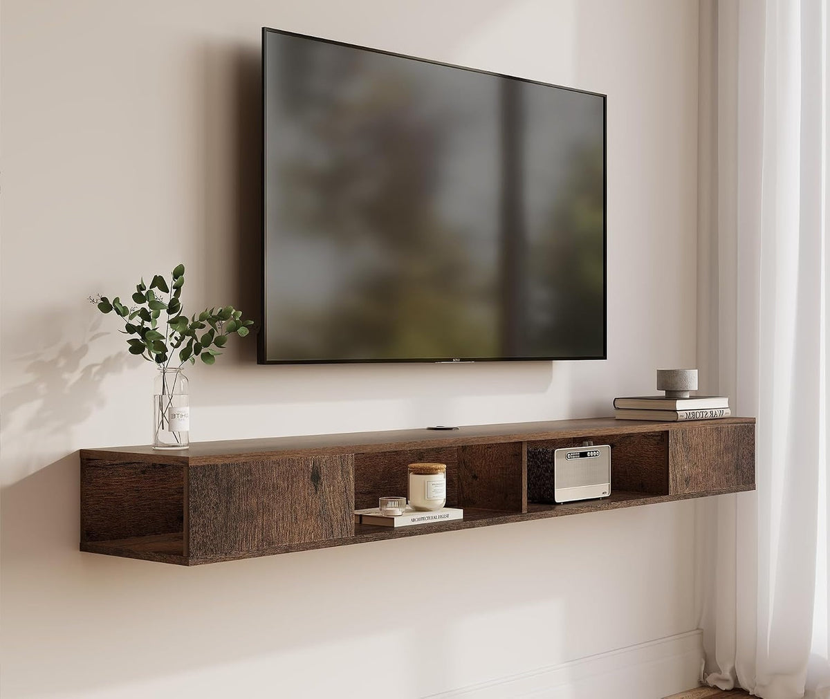 Brown floating TV console beneath a wall-mounted television, shown at an angle