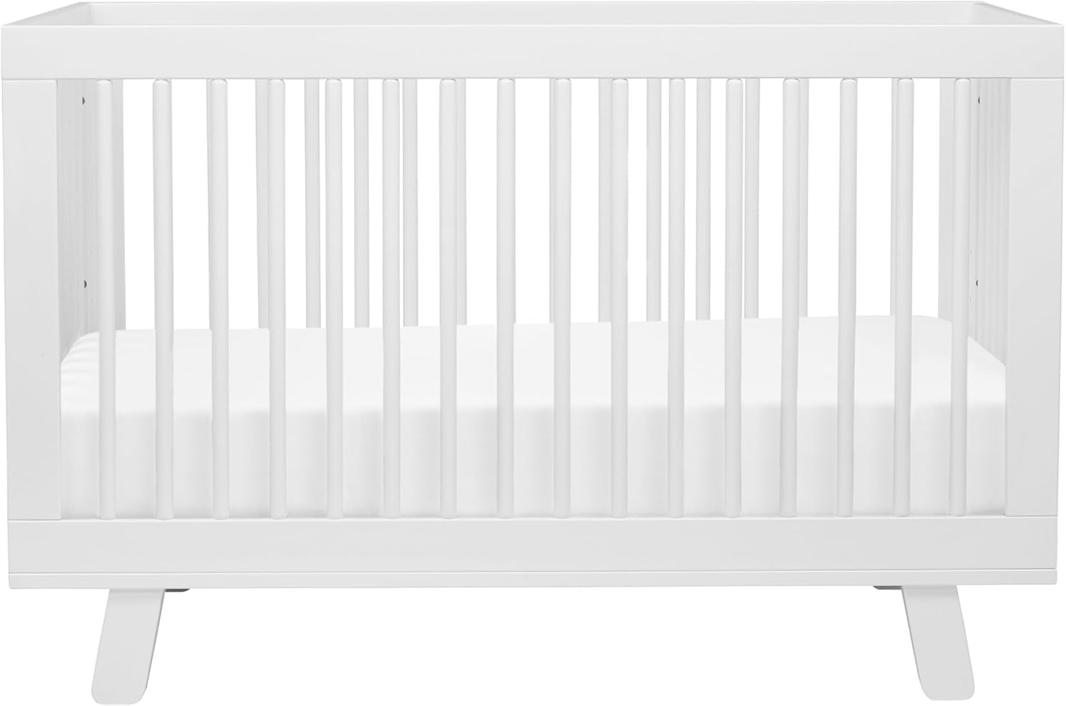 Front-facing white crib with slim vertical slats and a white mattress.