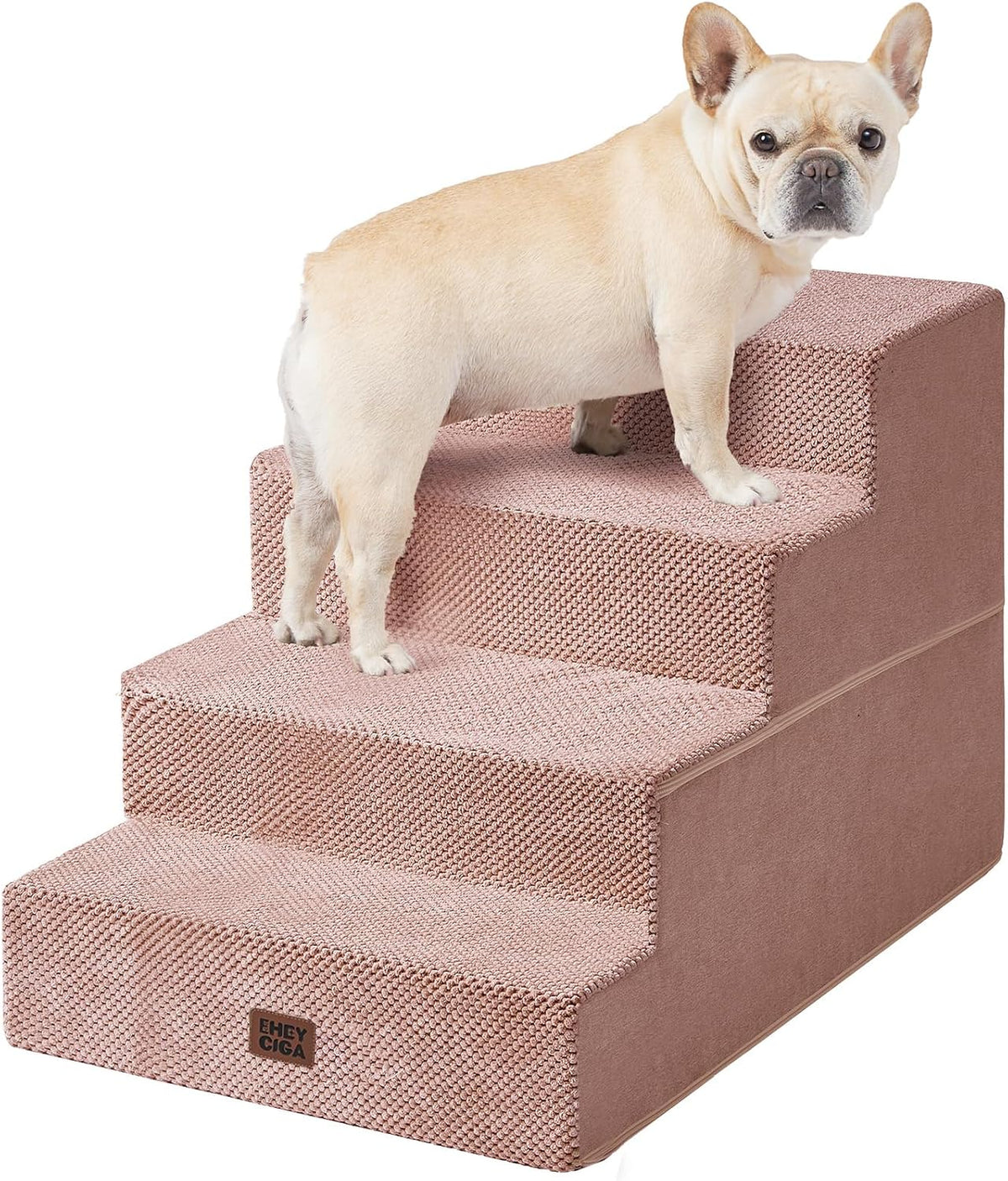 Close-front view of dusty rose four-step foam stairs with a small fawn dog standing near the top, knit texture visible.