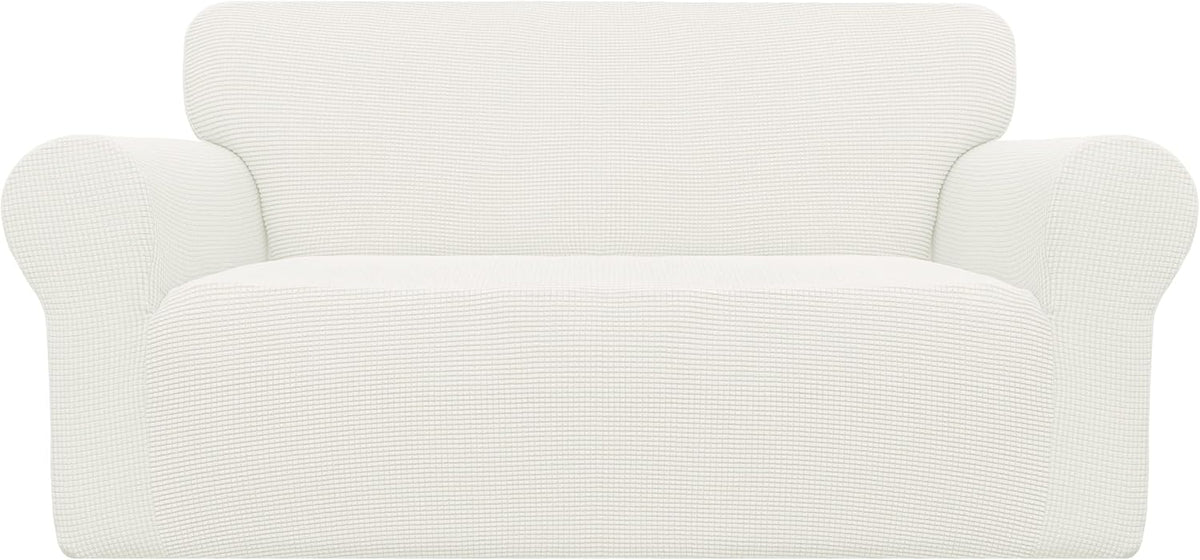 Front view of a loveseat with rolled arms covered in a white textured stretch slipcover.