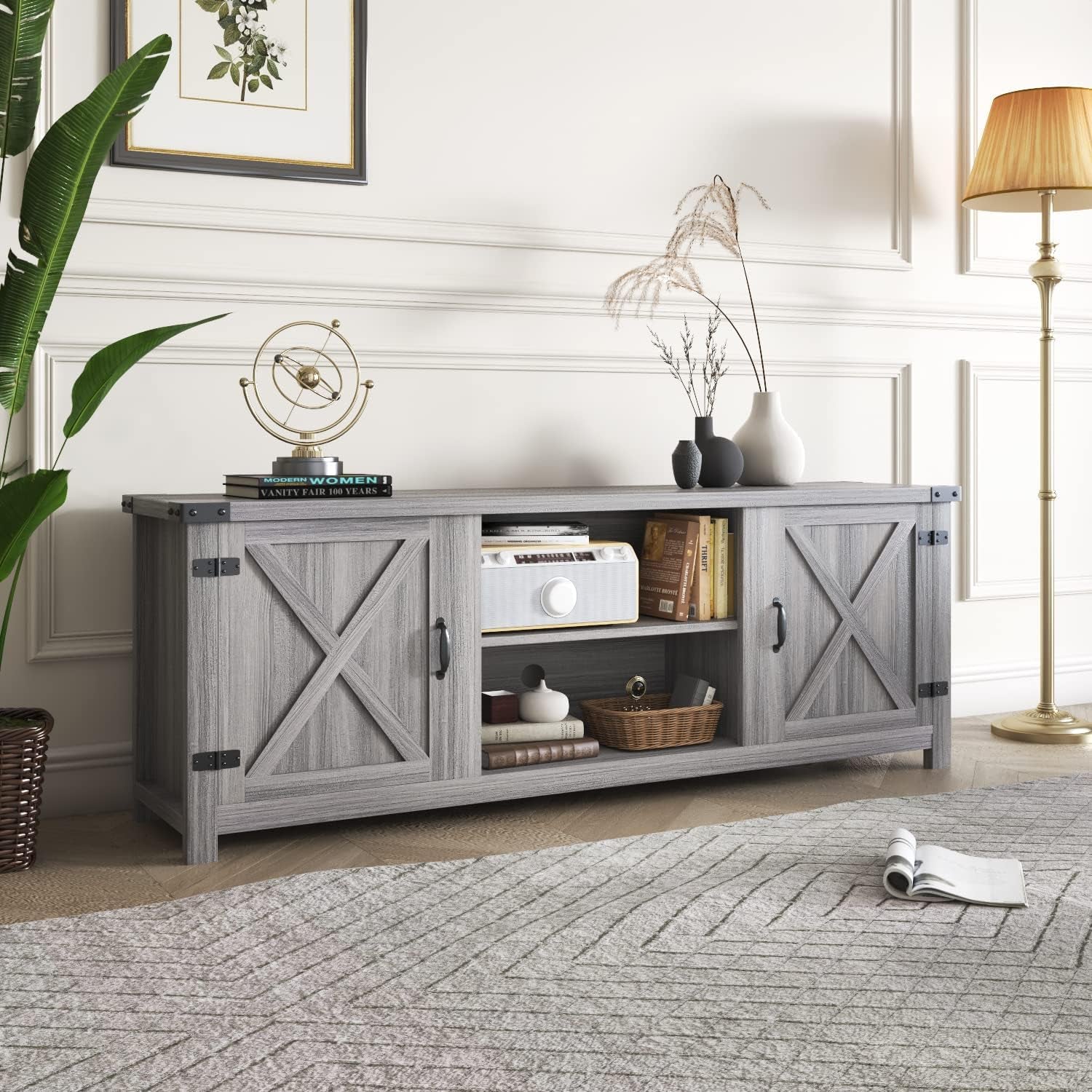 Close-up of left barn-door panel and dark metal hinge and handle hardware on the gray wash TV stand.
