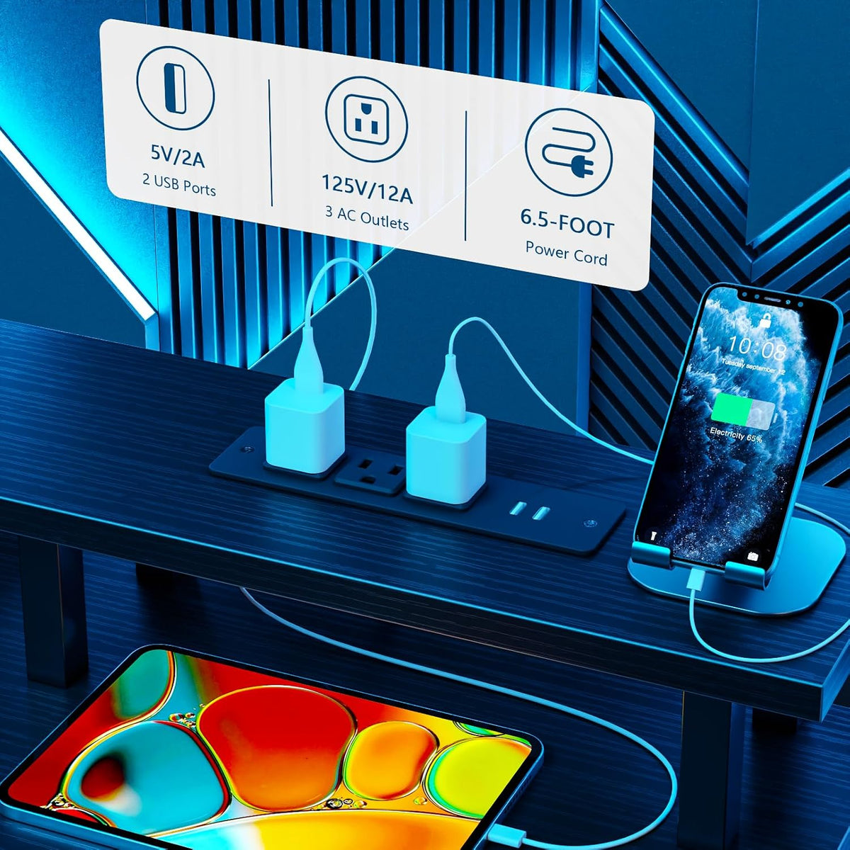 Close-up of the built-in power module on the monitor shelf with two USB ports, AC outlets and visible power cord