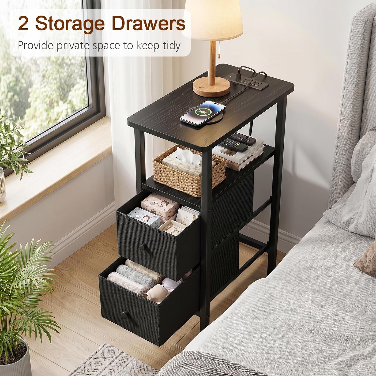 Black narrow table with two storage drawers, one drawer open showing contents