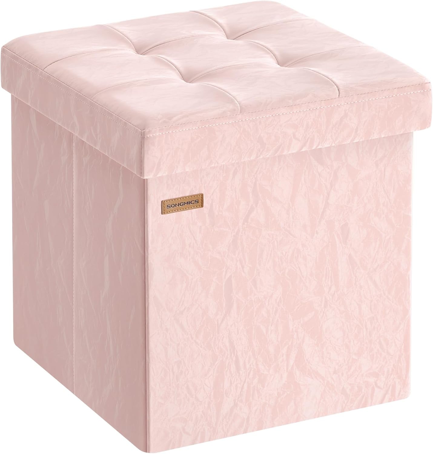 Square pale pink storage ottoman with tufted cushioned lid, shown at an angle