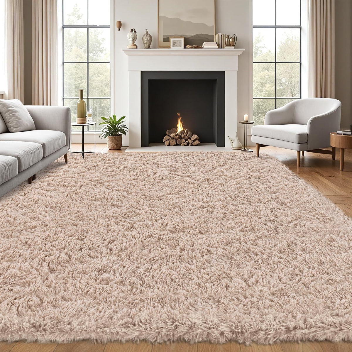 Living room with a pale blush-pink shag rug laid in front of a fireplace and neutral furniture.