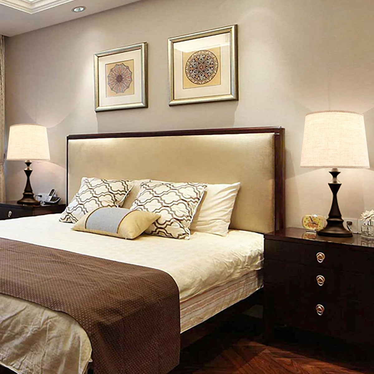 Beige drum shades shown on bedside table lamps in a staged bedroom setting