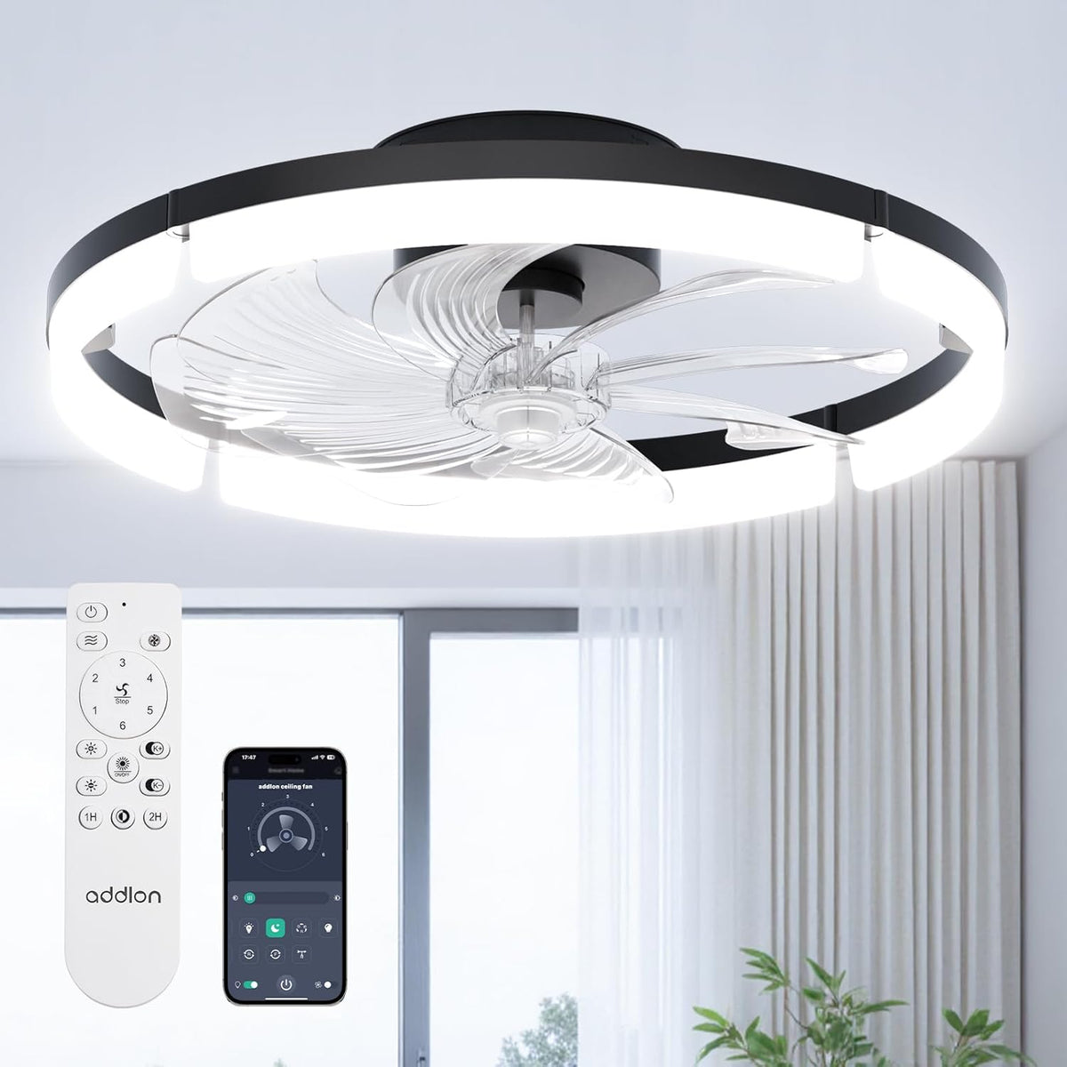 Low-angle close-up of the lit black ring fan showing clear sculpted blades and a remote with app screen nearby.