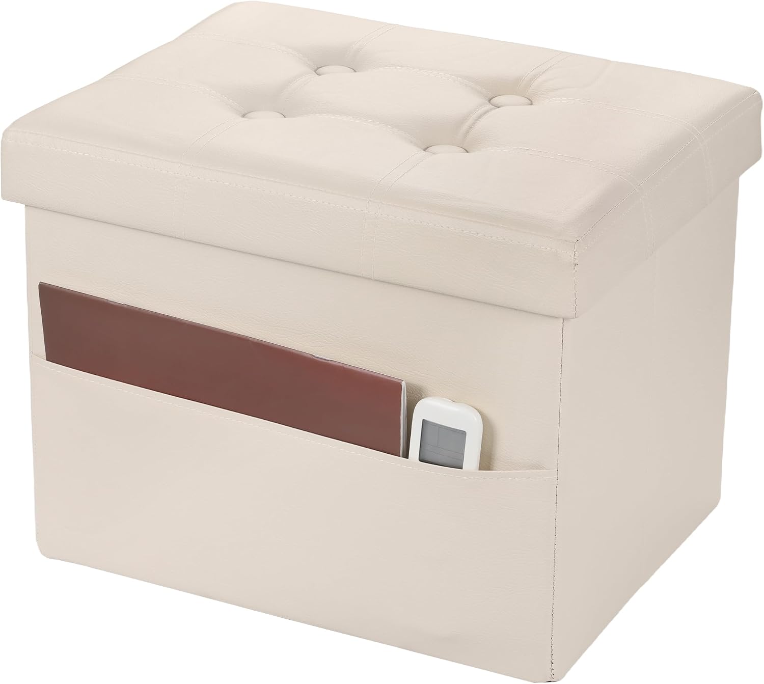 Cream tufted storage ottoman shown from an angle with a slim folder and a remote tucked into the front pocket