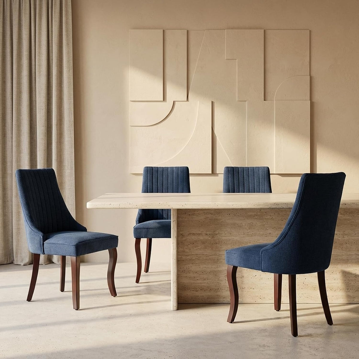 Angled view of three blue upholstered chairs with dark wood curved legs around a stone dining table.