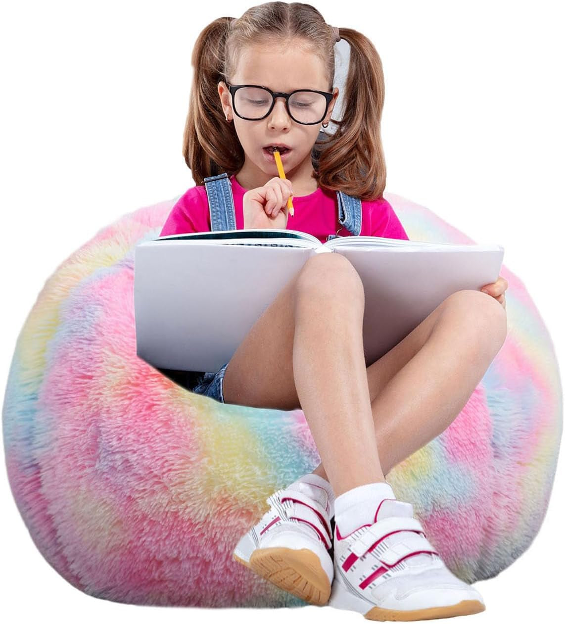 Child sitting cross-legged on a pastel rainbow faux-fur bean bag reading a book