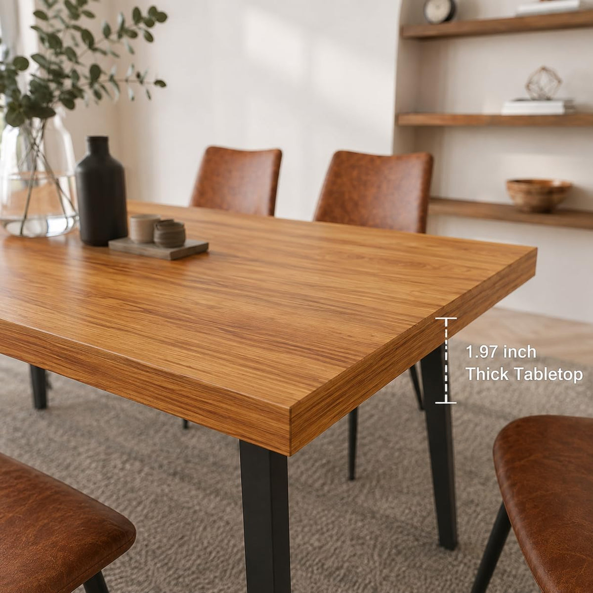 Close-up of the table corner showing woodgrain tabletop and black metal leg beneath.