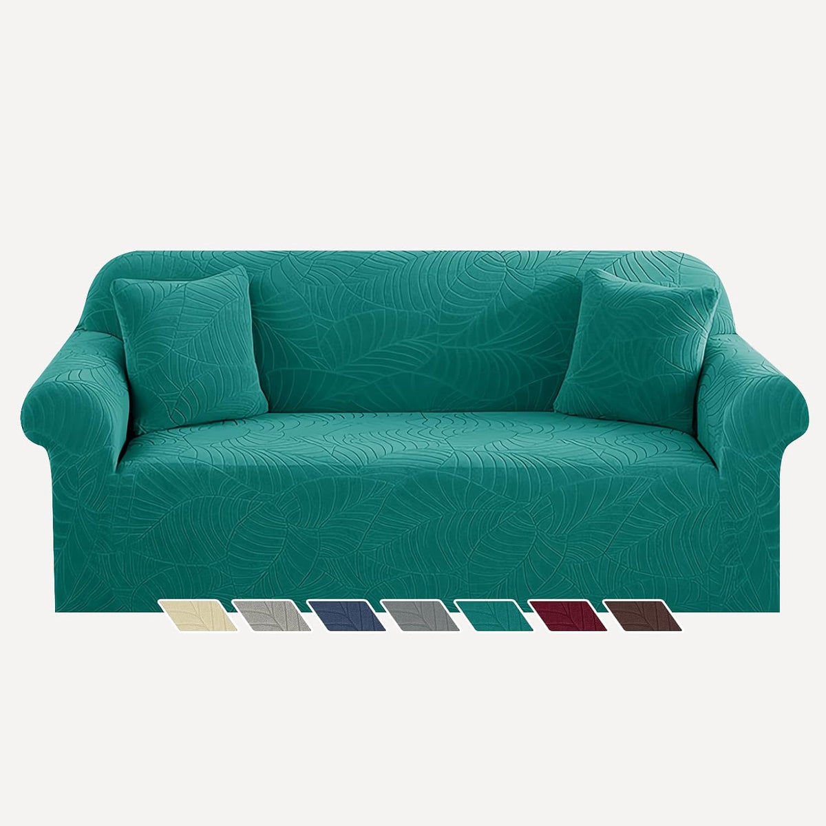 Three-seat sofa in bright teal textured slipcover with two matching throw pillows