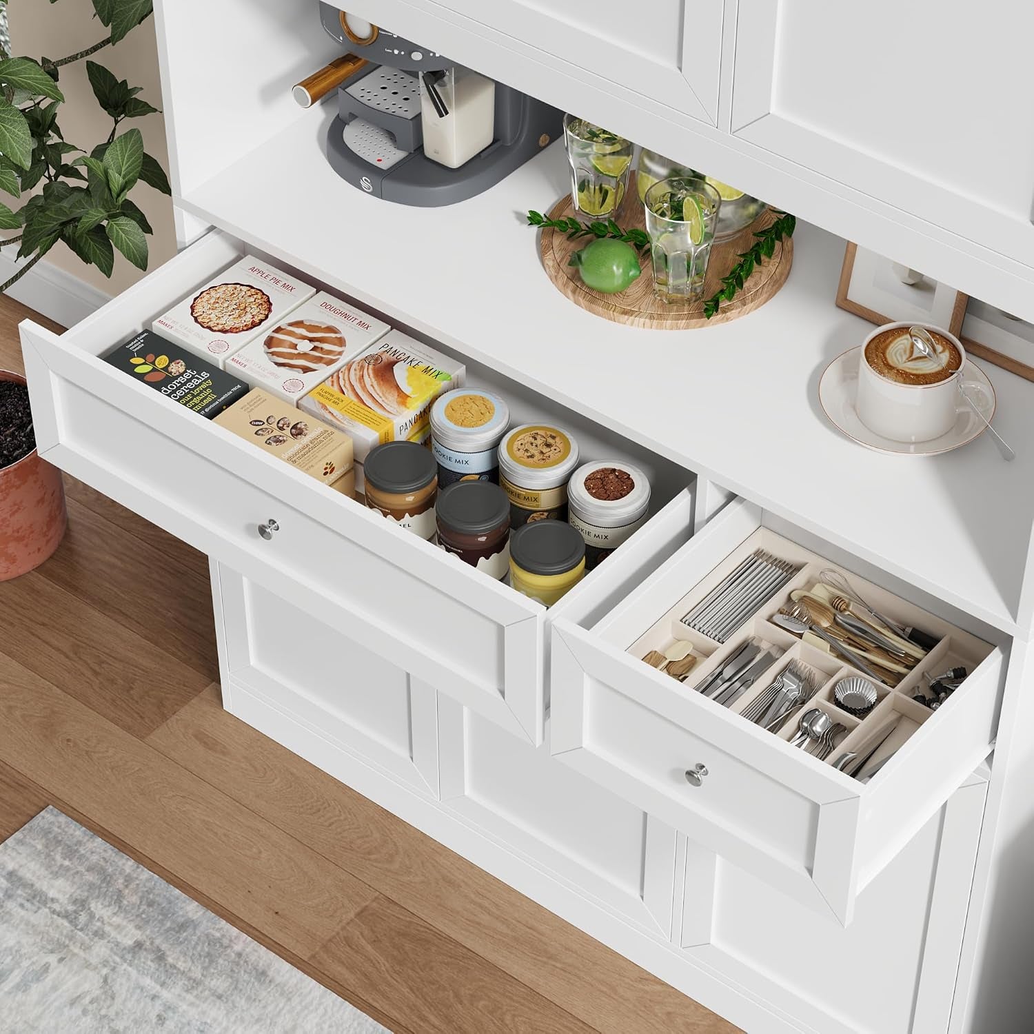 Close-up showing two open drawers with jars and a divided cutlery tray stored inside the white pantry hutch