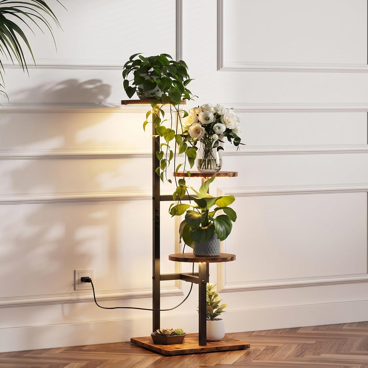Side view of the five-tier stand with a trailing power cord plugged into the wall and plants on staggered wooden shelves
