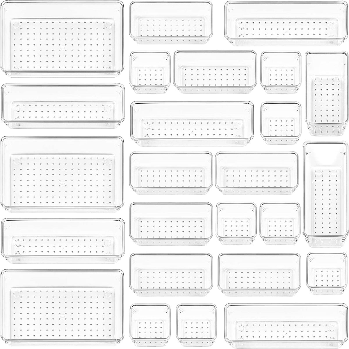 Top-down view of multiple clear plastic organizer trays laid out to show different sizes and dotted base texture