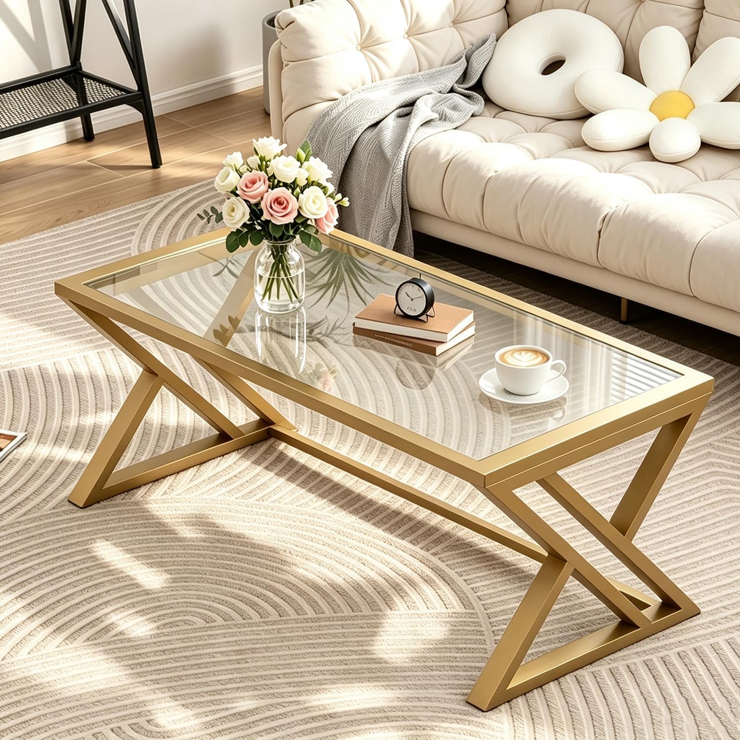 Three‑quarter view highlighting gold X‑leg joinery and reflective glass tabletop with vase and cup.