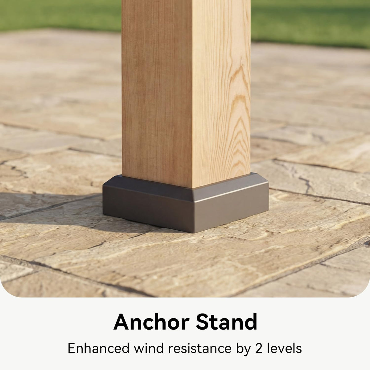 Tight close-up of a cedar post set into a dark metal anchor base resting on textured stone pavers.