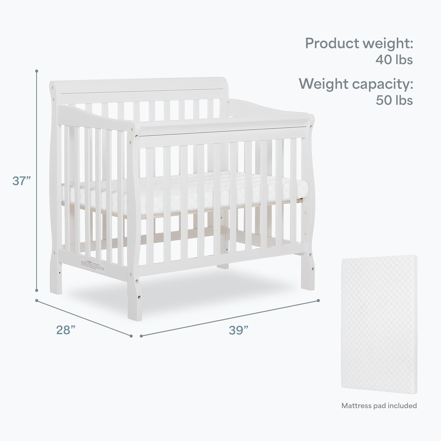 White crib shown with dimensional arrows and a mattress pad image on a light background