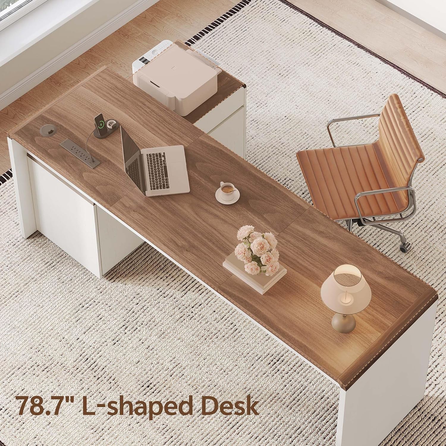 Top-down view of the L-shaped desk showing walnut surface, accessories, and attached cabinet