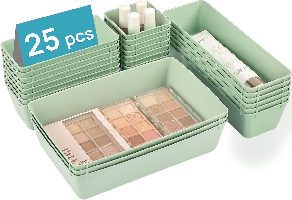 Angled view of stacked mint-green trays with palettes and small bottles placed inside some bins
