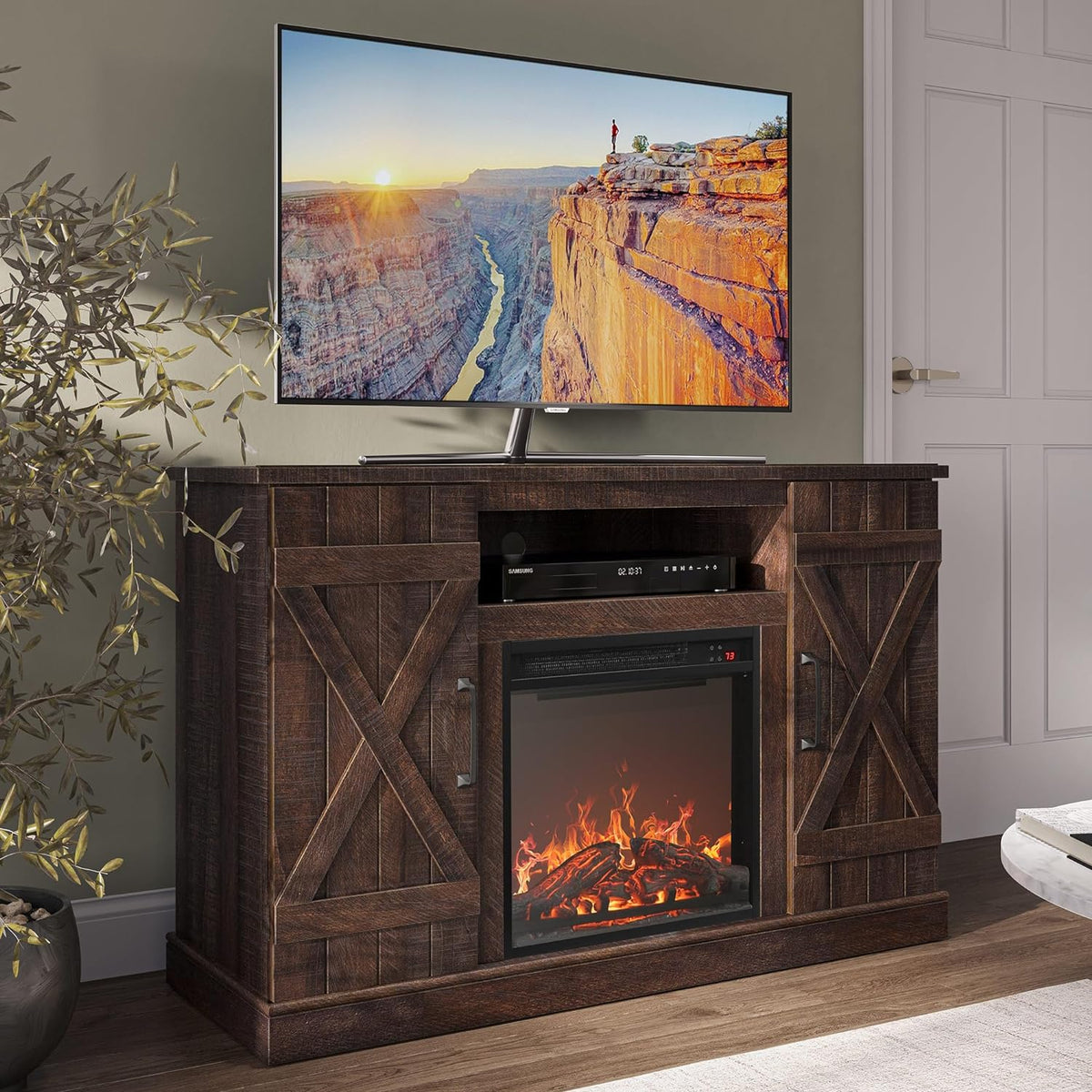 Tighter front-facing view of a deep brown wood TV stand showing barn doors and fireplace insert