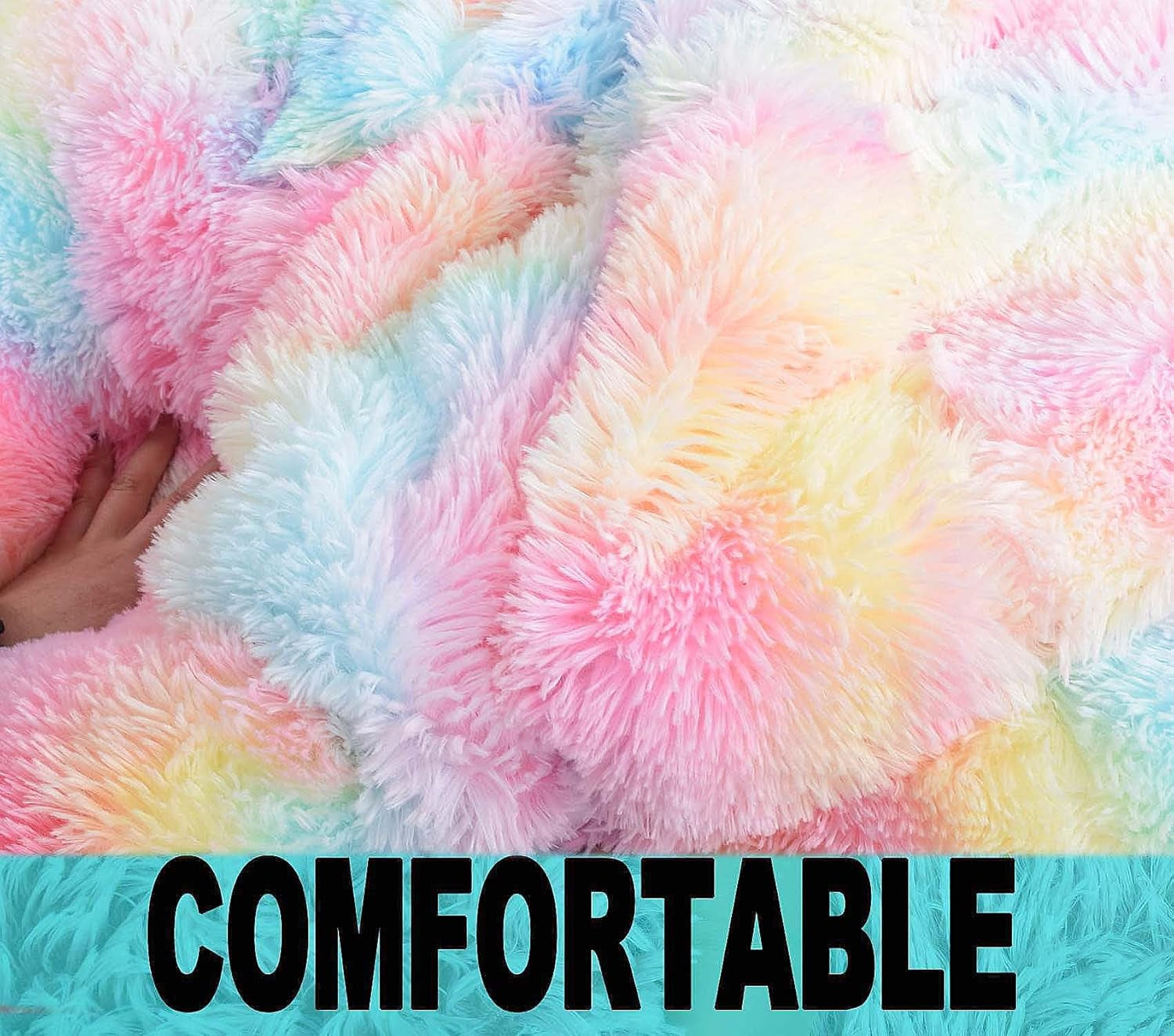 Close-up of multicolored pastel faux‑fur showing long fluffy pile with a hand pressing it.