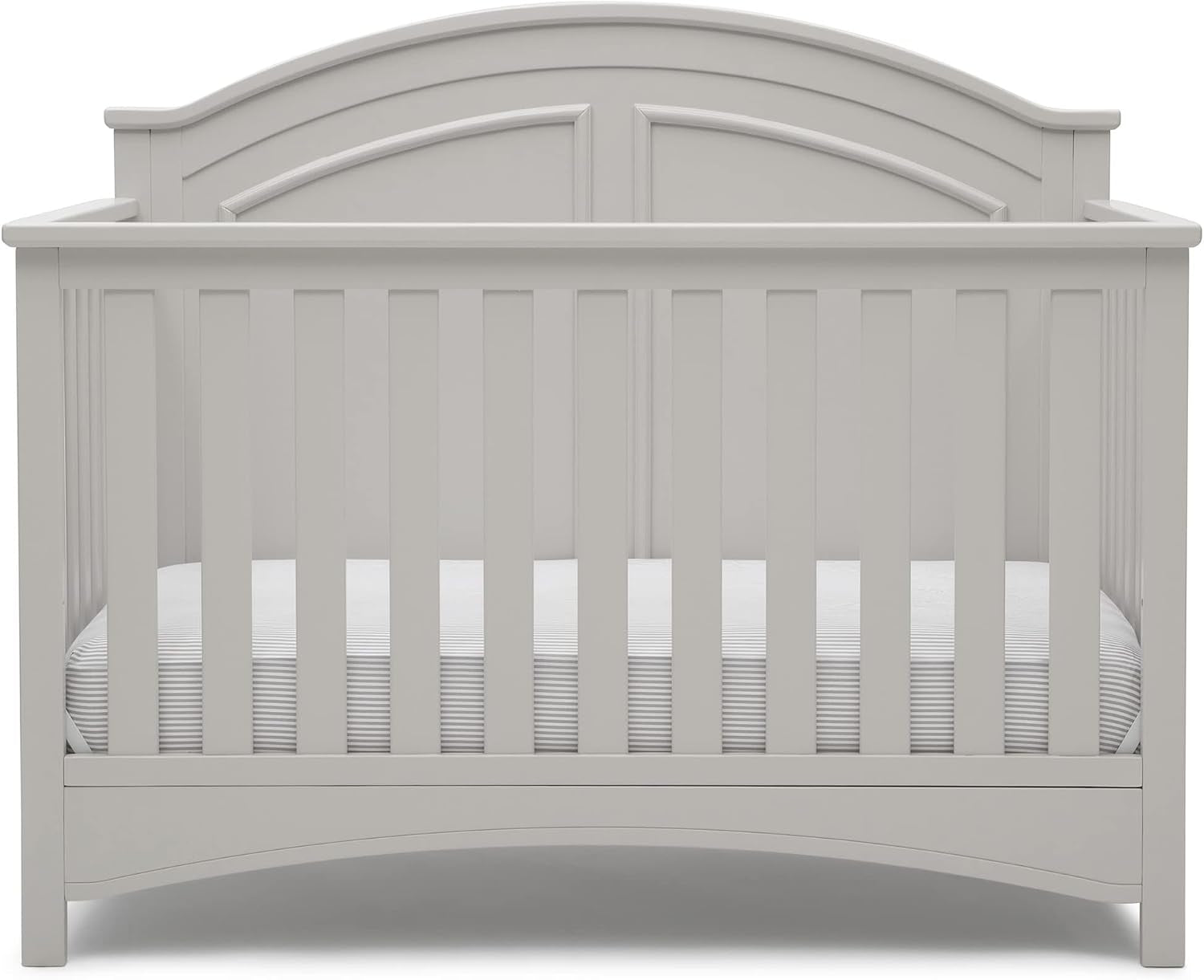 Front view of a white wooden baby crib with arched headboard and vertical slats.