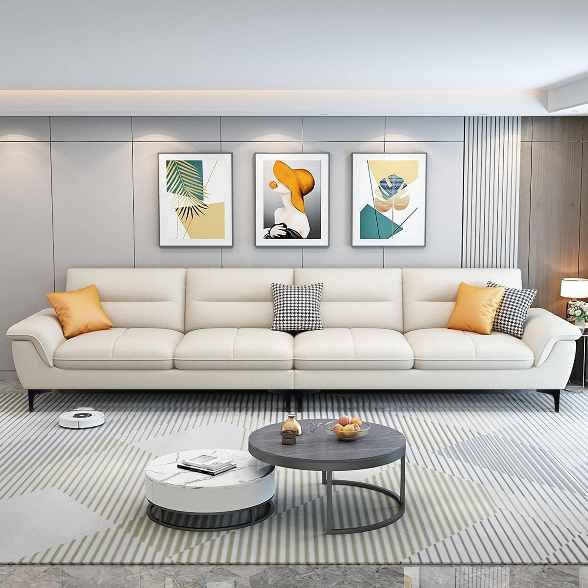 Cream three-seat sofa supported by thin black metal legs in a modern living room, front view