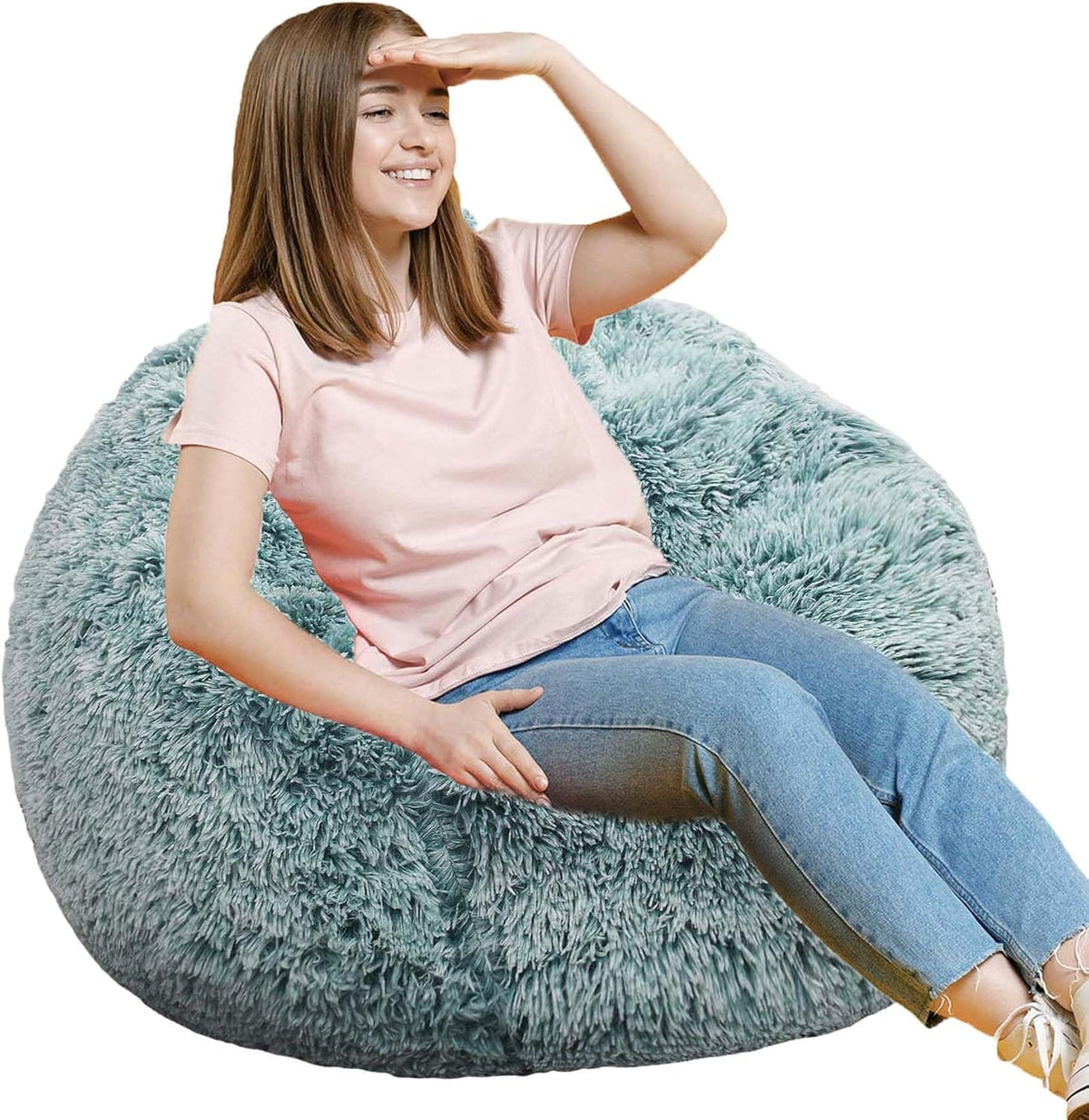 Girl leaning back in a fluffy mint-green round faux-fur bean bag chair
