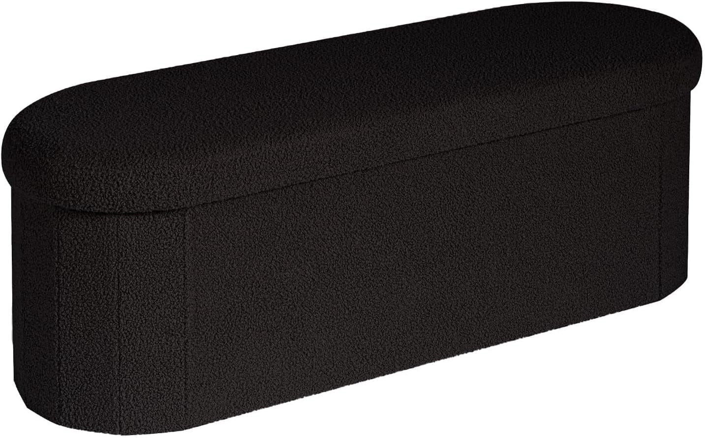 Long oval bench-style storage ottoman in black sherpa fabric, shown on white background
