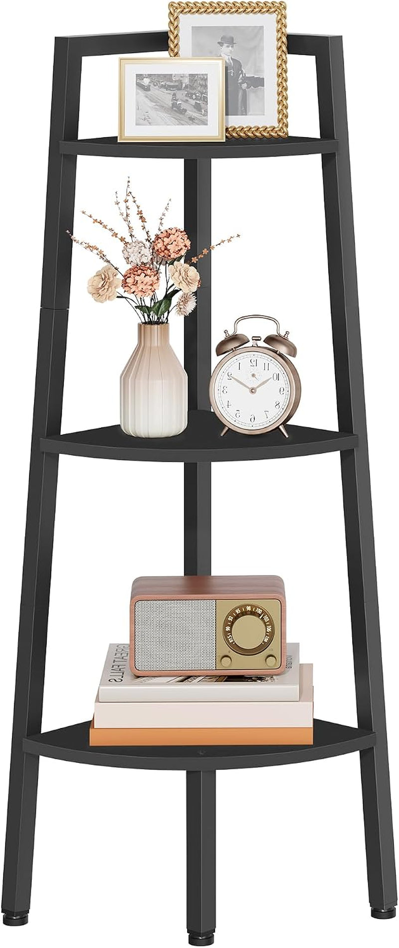 Styled mid-section of black corner ladder shelf with a vase, alarm clock and small radio on the shelves