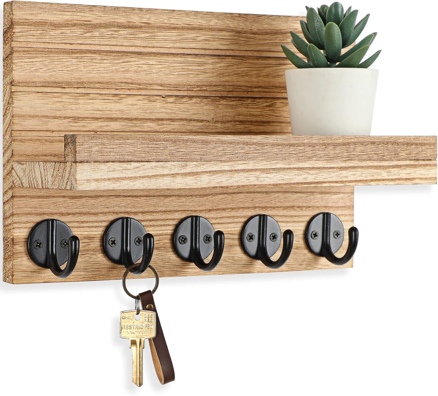 Light brown key holder with five black hooks, a shelf, potted succulent, and hanging key.