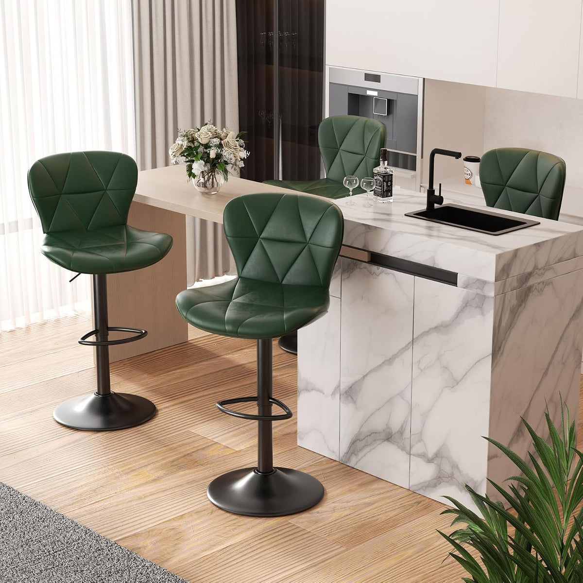 Three deep green swivel stools placed around a kitchen peninsula with a vase and sink on the counter.
