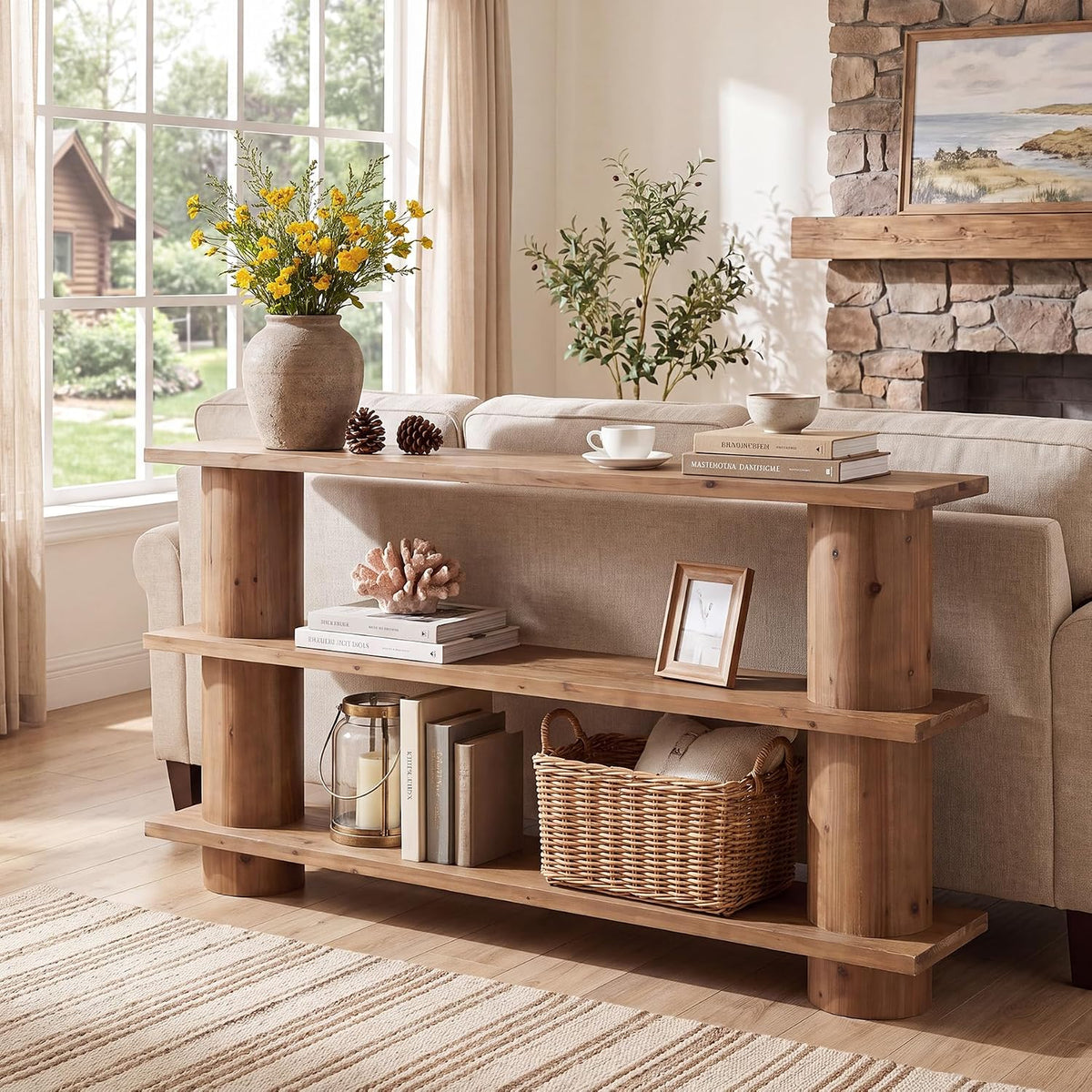 Natural wood console table placed behind a beige sofa with basket and decor, angled living room view