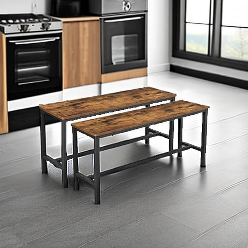 Pair of benches with rustic tops placed on a dark tile floor in a kitchen scene