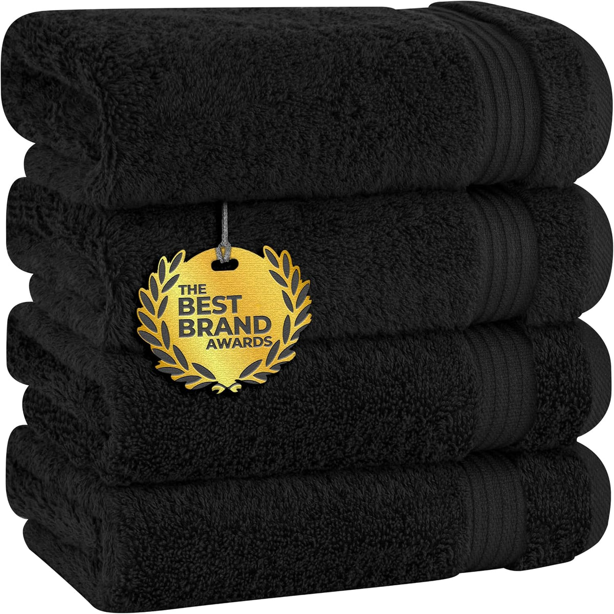 Four black towels stacked with a gold award medallion hanging on the front