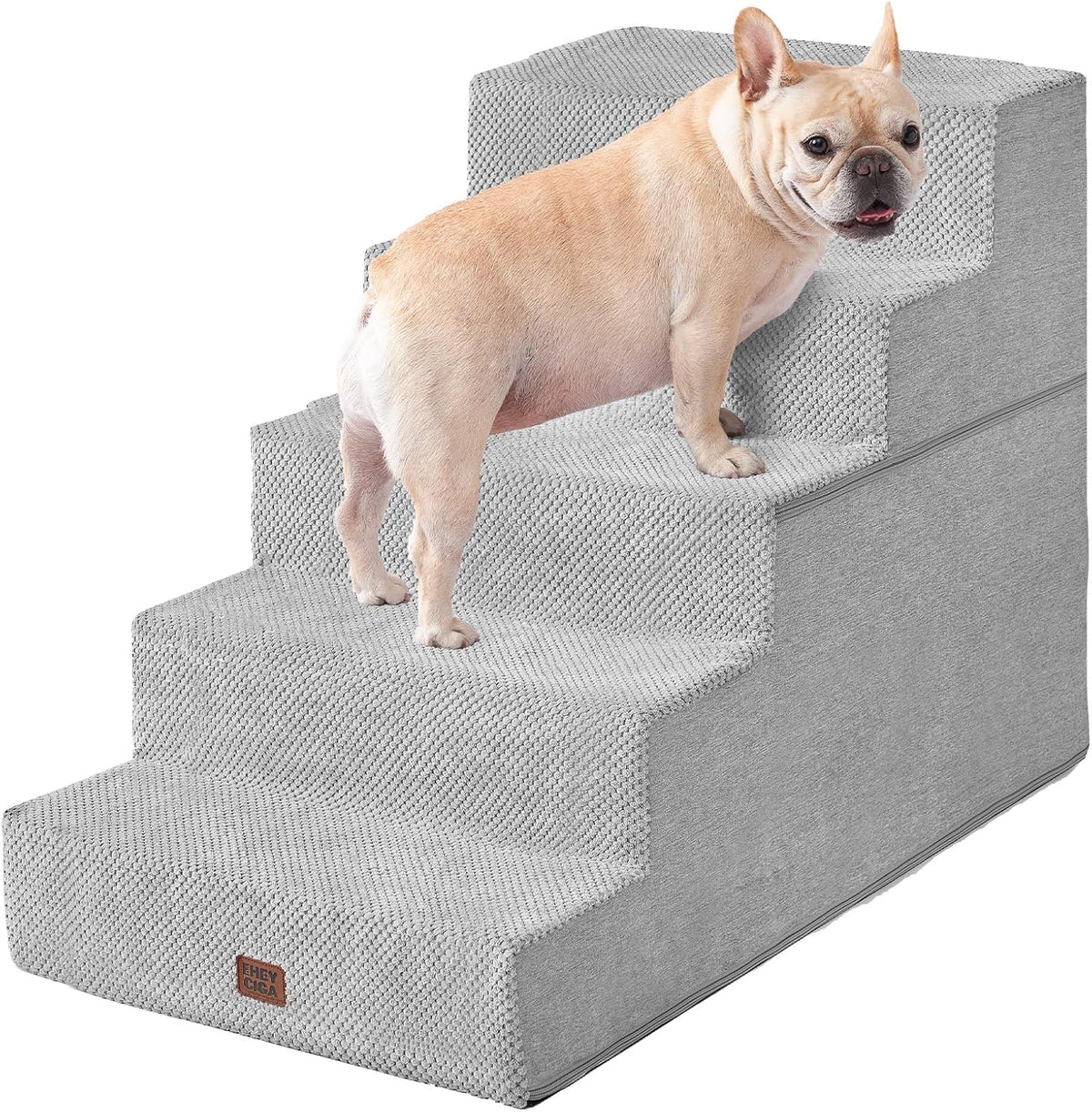Tan French bulldog on light gray four-step textured pet stairs angled to show side and steps
