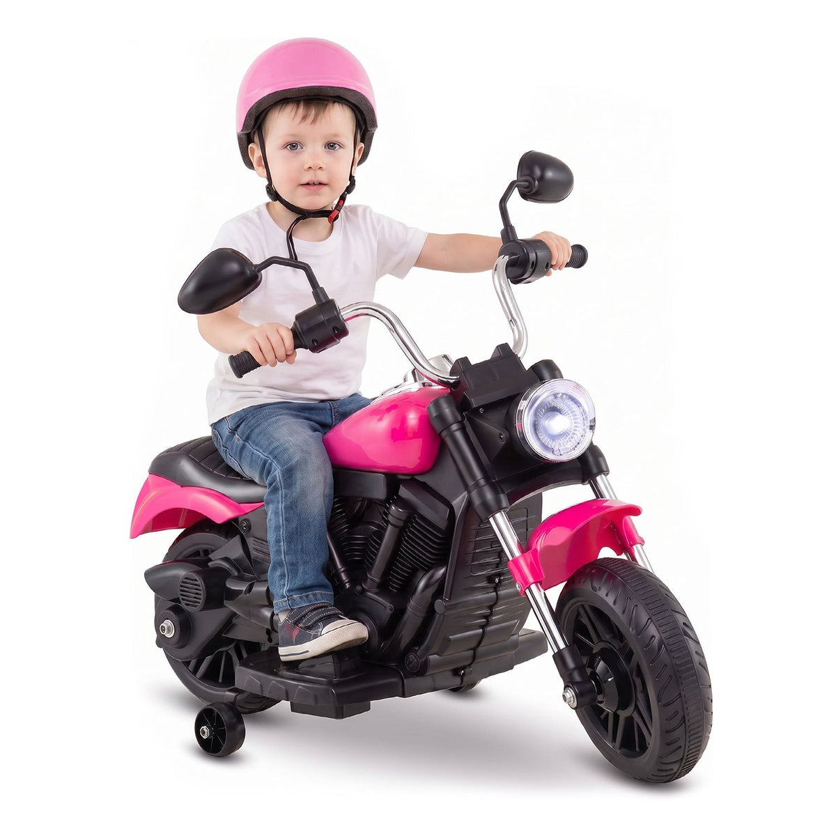 A child wearing a pink helmet sits on a pink toy motorcycle against a white background.