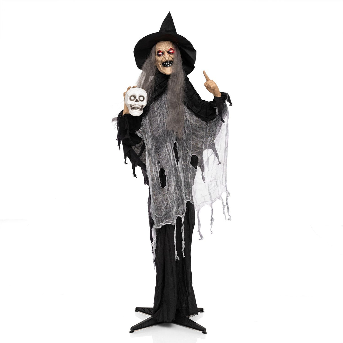 A full-length witch figure holds a skull and points upward, standing on a black base against a white background.