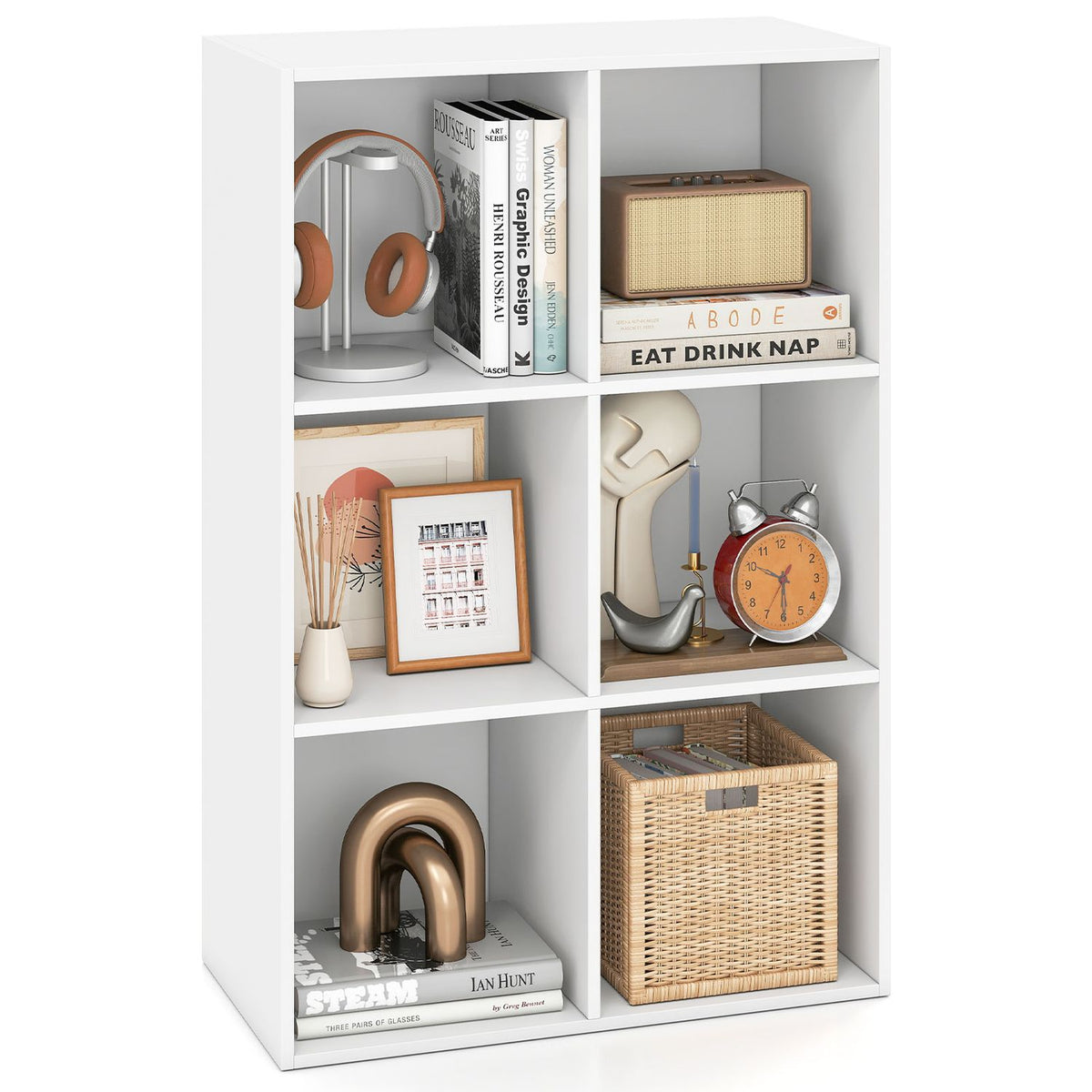 White six-cubby bookcase displayed against a plain background with books, headphones, a clock, and decor.