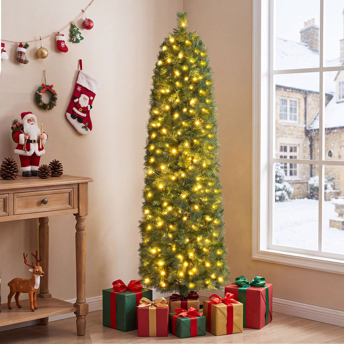 Tall artificial pine tree glowing with warm lights beside a snowy window, with gifts below.