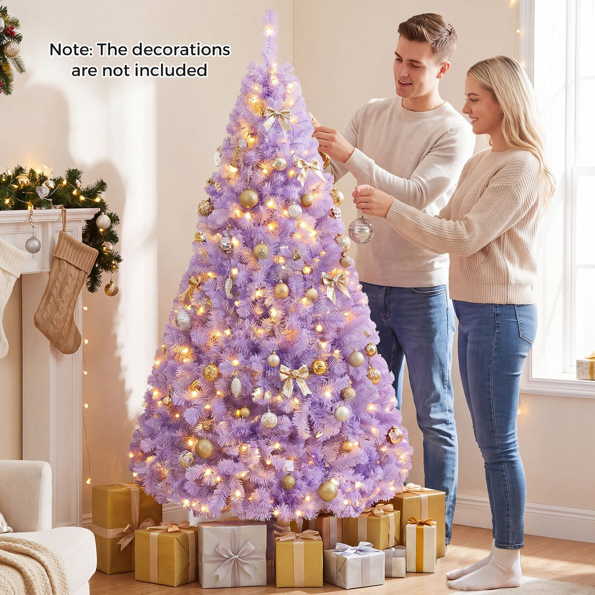 A couple decorates a glowing lavender Christmas tree beside a fireplace and wrapped gifts.