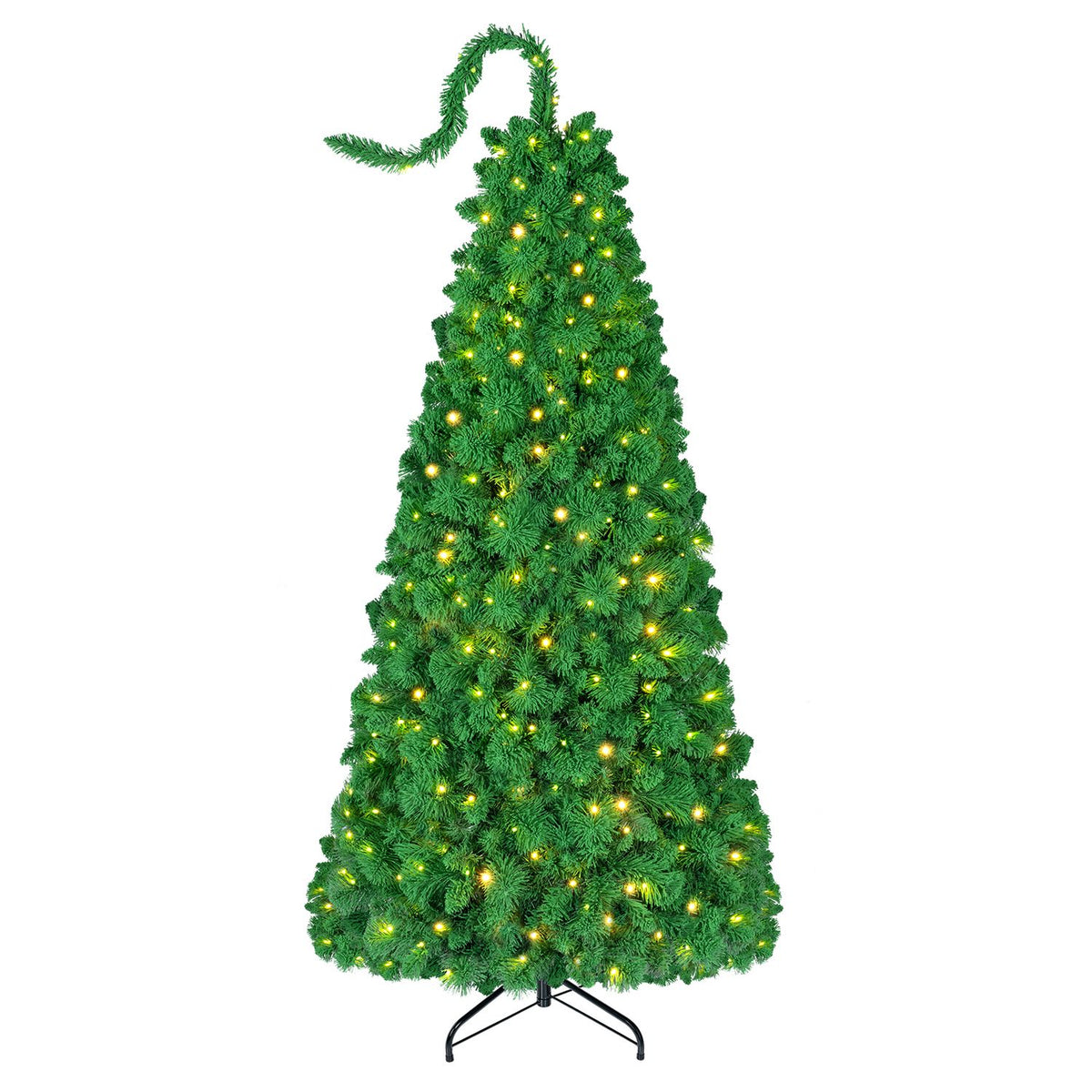 Green Christmas tree with warm lights and a curled top, shown on a metal stand against white.