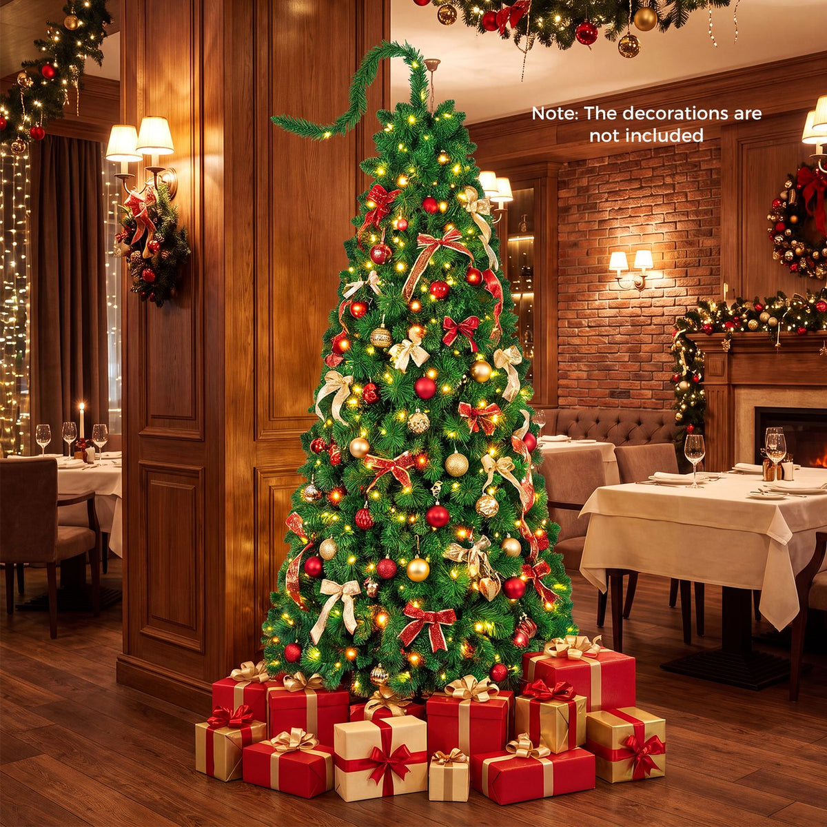 A decorated, glowing Christmas tree with a curled top is displayed with presents in a warmly lit dining room.